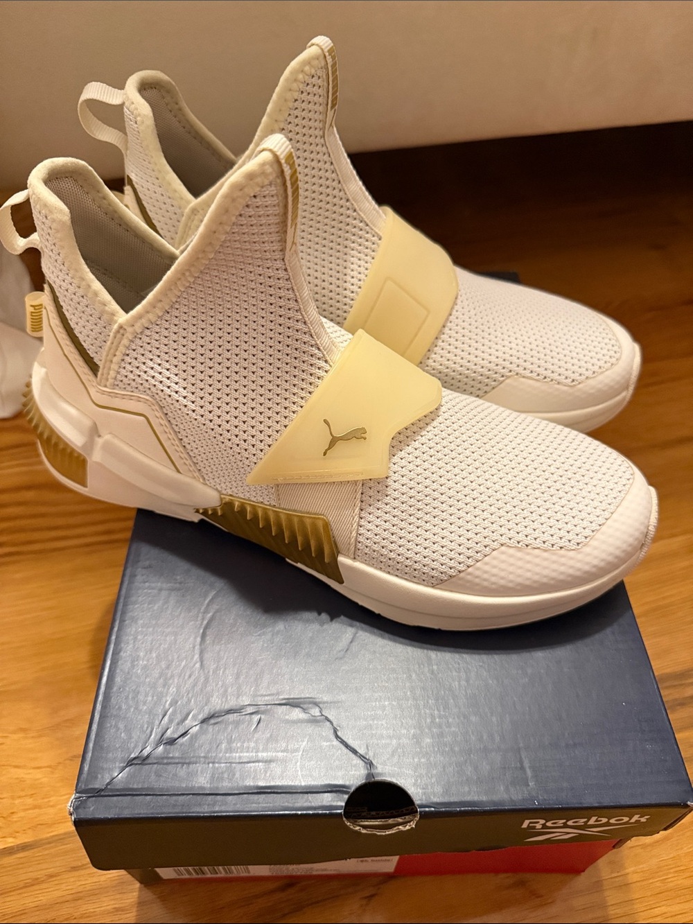 Puma Woman’s Slip-On Sneakers in Cream and Gold Accent